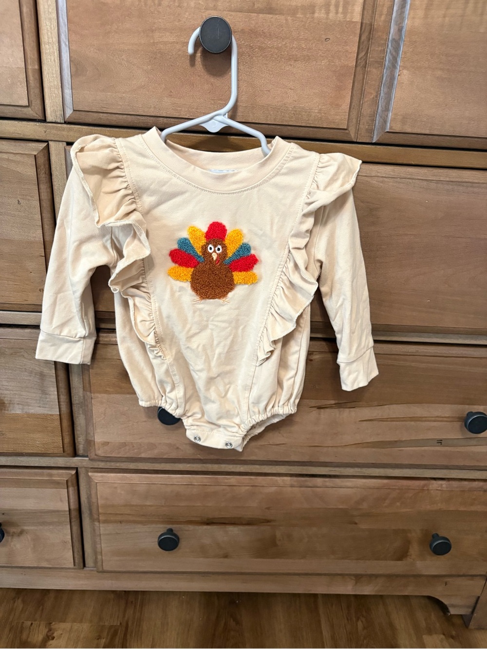 Cream Ruffle Turkey One-Piece Bodysuit for Kids